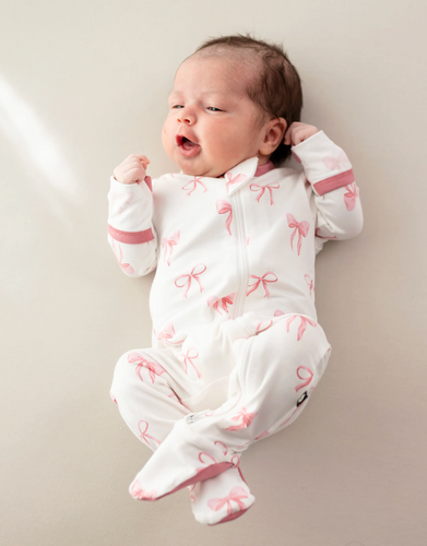 KYTE BABY ZIPPERED FOOTIE IN BOW