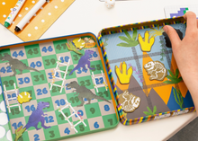 Load image into Gallery viewer, MAGNETIC FUN &amp; GAMES TIN DINOSAUR            FLOSS &amp; ROCK